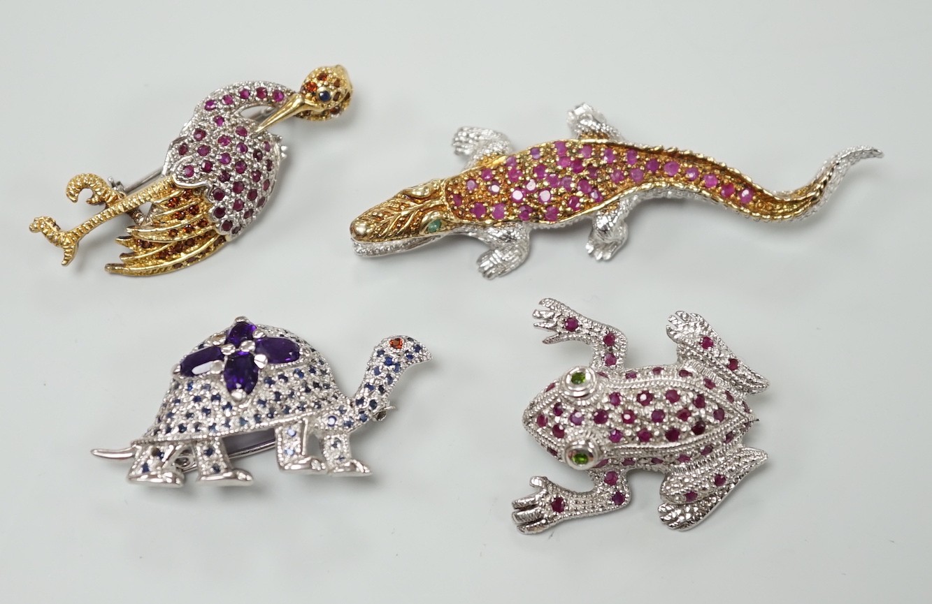 Four assorted modern white metal and coloured paste set miniature animal brooches, three stamped 925, including frog, crane, tortoise and crocodile.